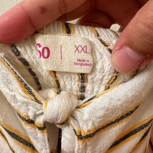 Size XL but fits tight especially if you have curves